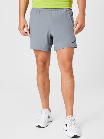 NIKE Regular Sports trousers in Grey: front