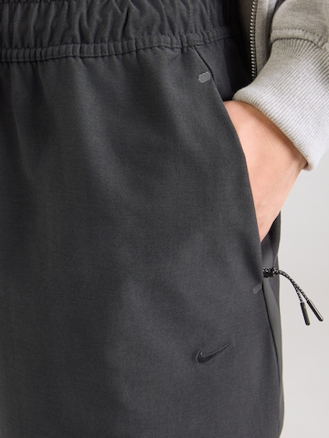juoda Nike Sportswear Laisvas Kelnės