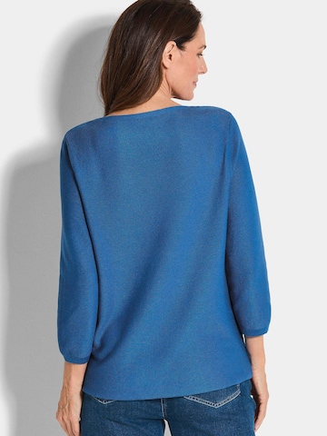 Goldner Pullover in Blau