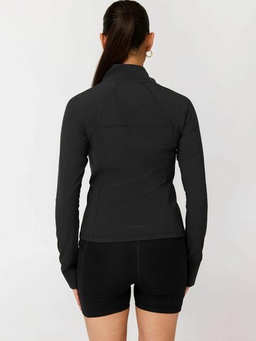 Girlfriend Collective Urheilutakki ' Estrella ' värissä musta