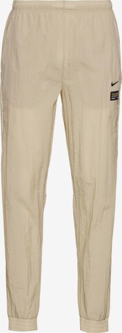 NIKE Tapered Outdoor Pants 'FC' in Beige: front