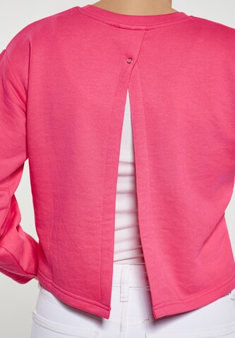 Sweat-shirt swirly en rose