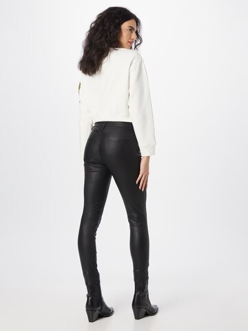 Skinny Pantaloni 'INA' de la AllSaints pe negru