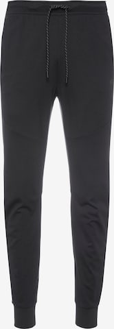 Effilé Pantalon 'Tech Essentials' Nike Sportswear en noir : devant