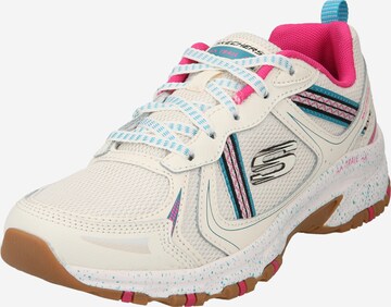 Baskets basses SKECHERS en beige : devant