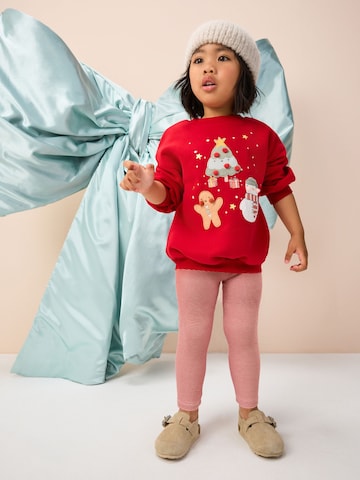 Next Set i röd: framsida