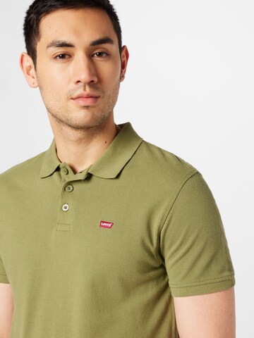 LEVI'S ® T-shirt 'Housemark Polo' i grön