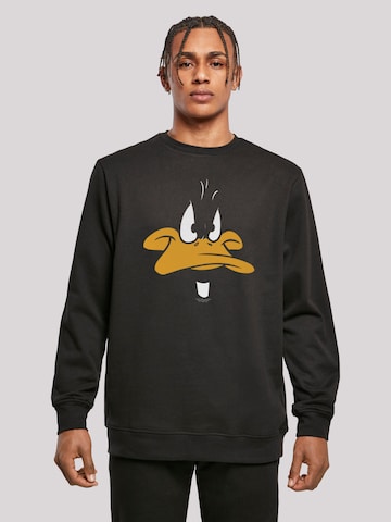 Sweat-shirt 'Looney Tunes Daffy Duck' F4NT4STIC en noir : devant