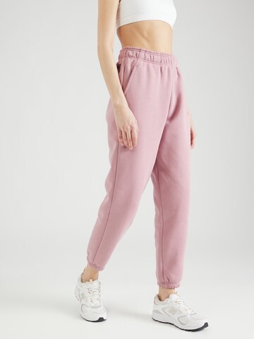 Effilé Pantalon 'Iconic' new balance en rose : devant