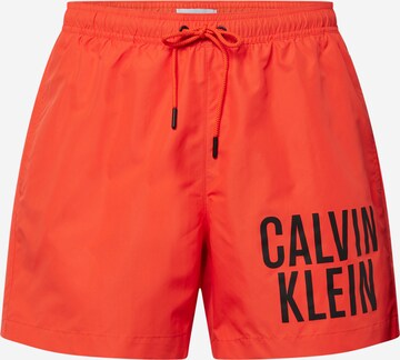 Calvin Klein Swimwear Board Shorts in Orange: front