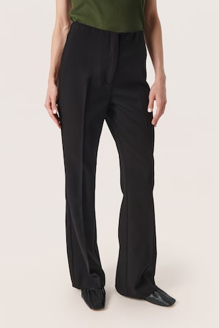 SOAKED IN LUXURY Flared Pants 'Corinne' in Black: front