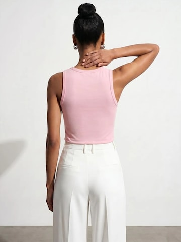 Top di Dilvin in rosa