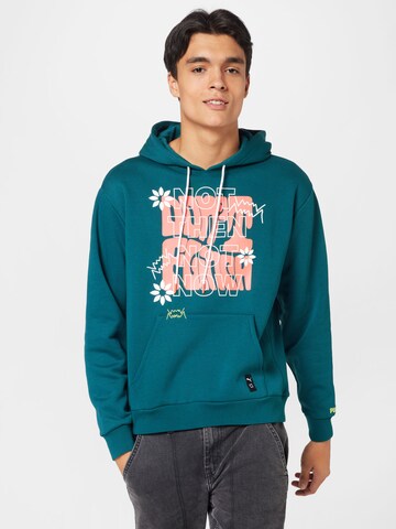 PUMA Sports sweatshirt 'Run it Back' in Green: front