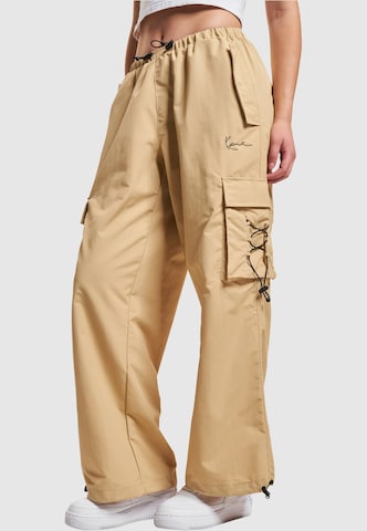 Karl Kani Lużny krój Spodnie w kolorze beżowy: przód