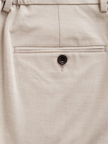 Coupe slim Pantalon à plis Next en beige