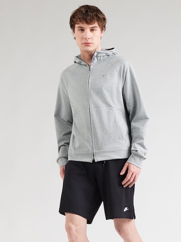 NIKE Urheilullinen collegetakki värissä harmaa: etupuoli