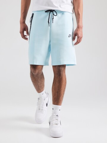 Nike Sportswear Ohlapna forma Hlače 'TCH FLC' | modra barva: sprednja stran