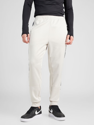 Regular Pantaloni sport 'AIR' de la Nike Sportswear pe bej: față