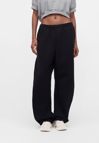 Nike Sportswear - Pierna ancha Pantalón 'Studio' en negro: frente