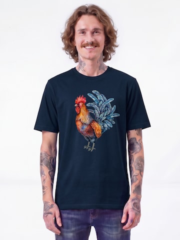 Maglietta 'Grimmiger Gockel' di Watapparel in blu: frontale