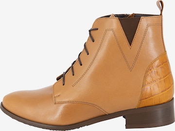 Usha Lace-Up Ankle Boots in Brown: front
