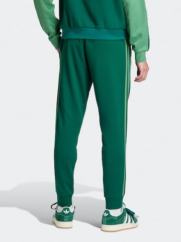 ADIDAS ORIGINALS Tapered Pants 'Adicolor Classics Sst' in Green
