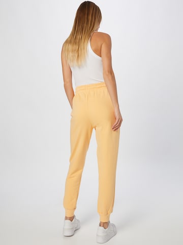 River Island - Tapered Calças em laranja