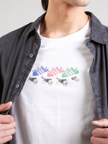 ADIDAS ORIGINALS - Camiseta 'Q12 TS ROLLER' en blanco