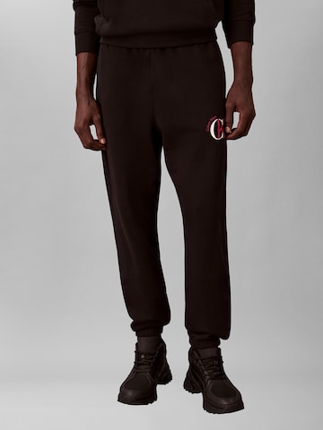 Calvin Klein Jeans - Tapered Pantalón en negro: frente