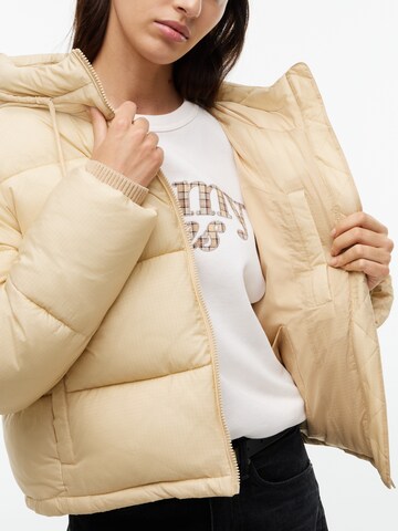 Tommy Jeans Zimní bunda – béžová