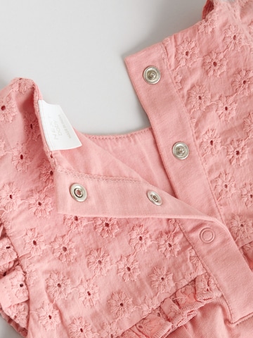 Next - Pijama entero/body en amarillo