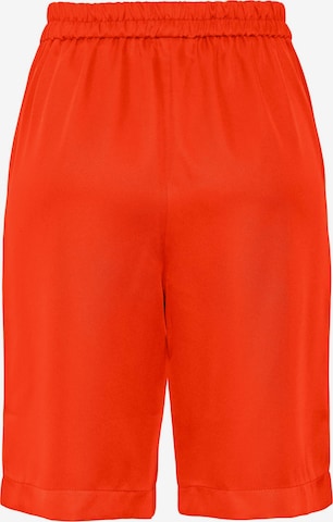 PIECES Loose fit Pleat-front trousers 'Tally' in Orange
