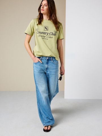 Tricou de la Next pe verde