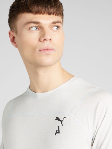 PUMA Functioneel shirt 'SEASONS' in Grijs