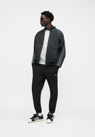 ADIDAS ORIGINALS Tussenjas 'SST' in Zwart