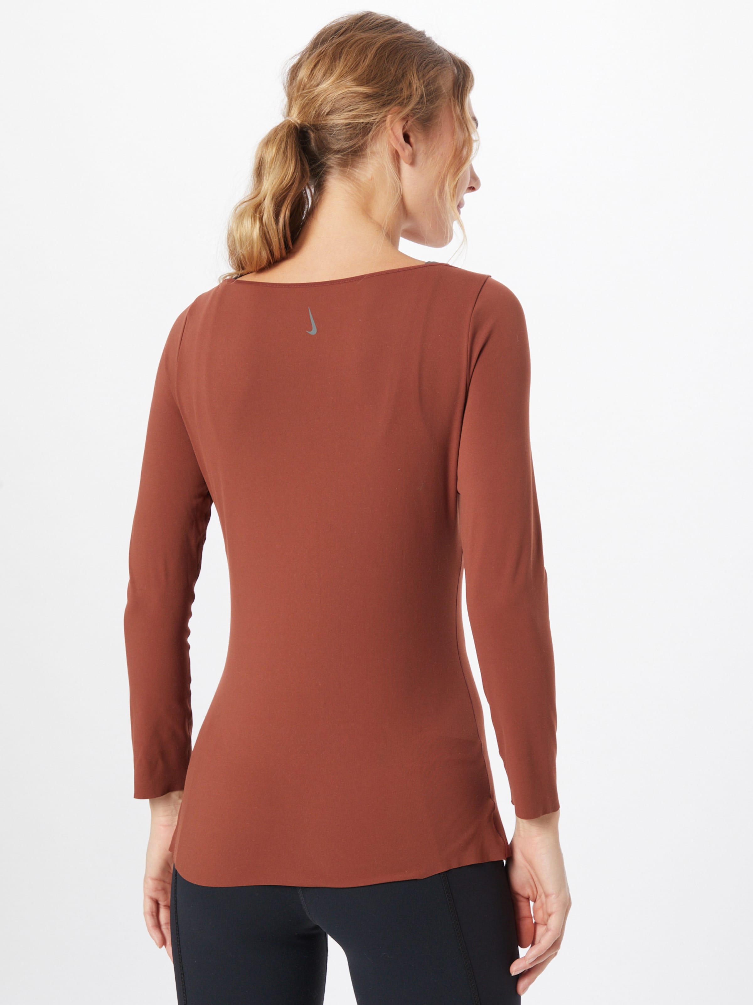 Frauen Sportbekleidung NIKE Shirt 'Yoga Luxe' in Rostbraun - ZN61245
