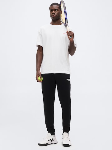 BJÖRN BORG - Tapered Calças de desporto 'ESSENTIAL 1' em preto