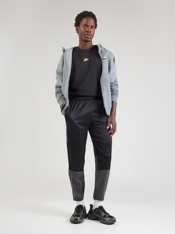 NIKE Zúžený strih Športové nohavice 'CHLNGR' - Čierna