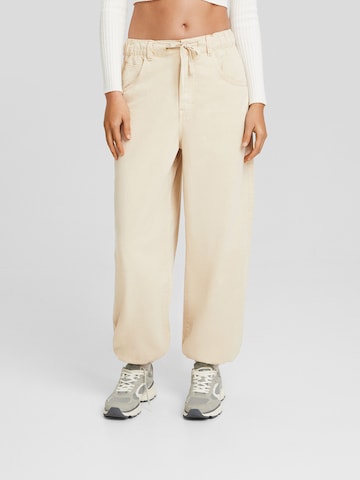 Bershka Дънки Tapered Leg Дънки в жълто: отпред