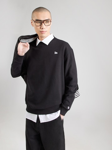 Sweat-shirt 'ESSNTIALS' NEW ERA en noir : devant