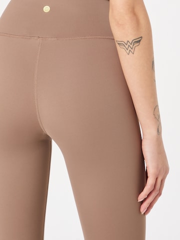 Athlecia Skinny Workout Pants 'GABY' in Brown