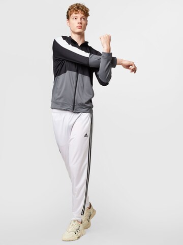 ADIDAS SPORTSWEAR Zwężany krój Spodnie sportowe 'Essentials Warm-Up' w kolorze biały