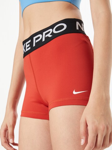 NIKE Skinny Fit Спортен панталон 'Pro' в червено