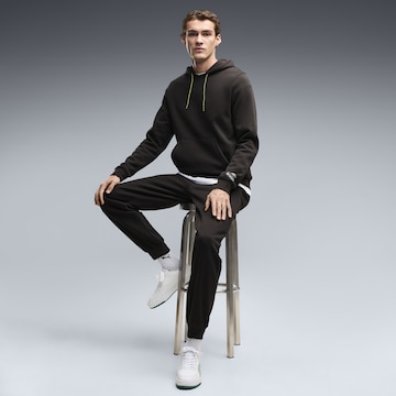 PUMA Sporttrui 'MARTIN ARAMCO F1® TEAM' in Zwart