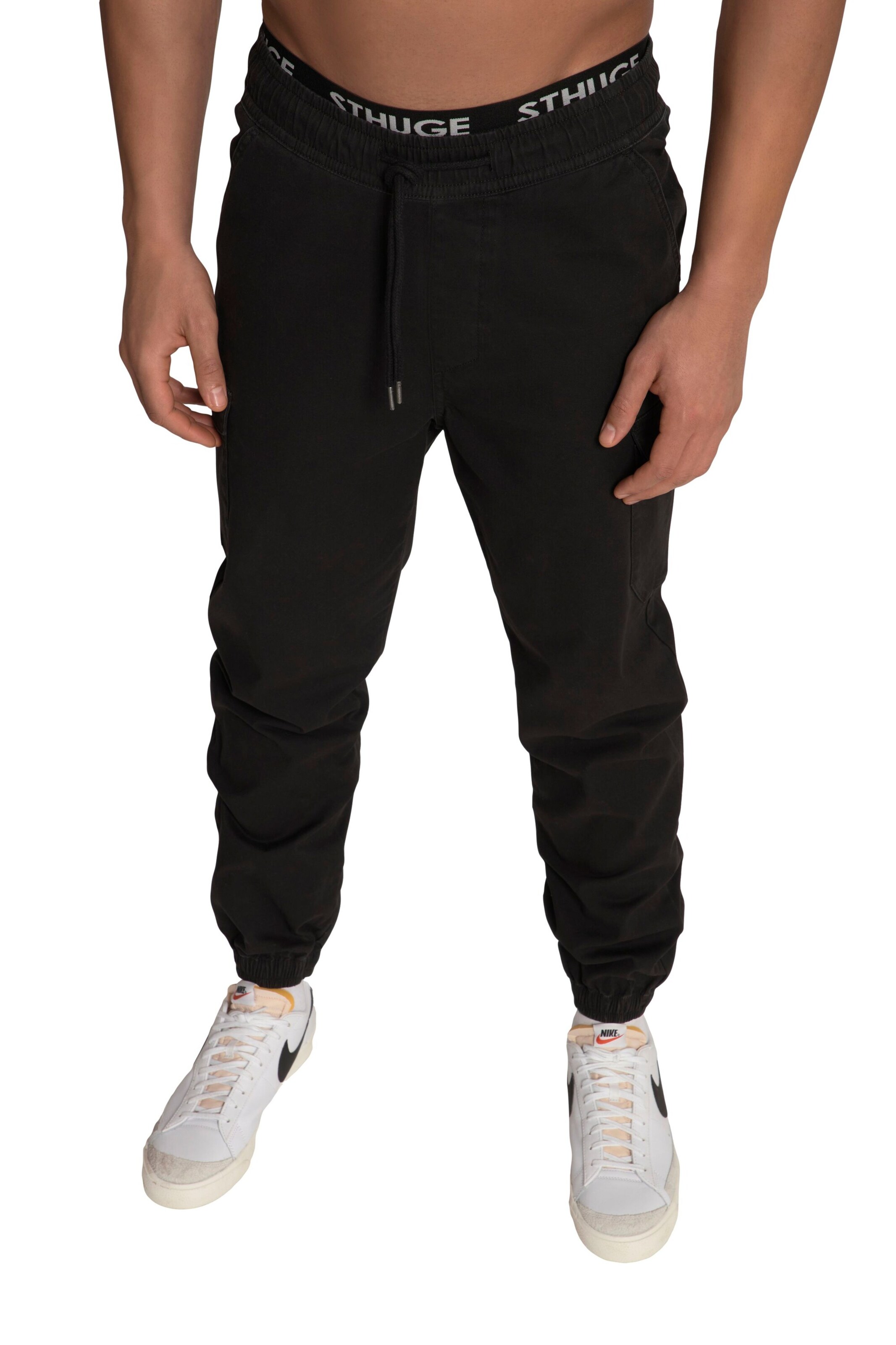 STHUGE Tapered Cargo Pants in Black: front
