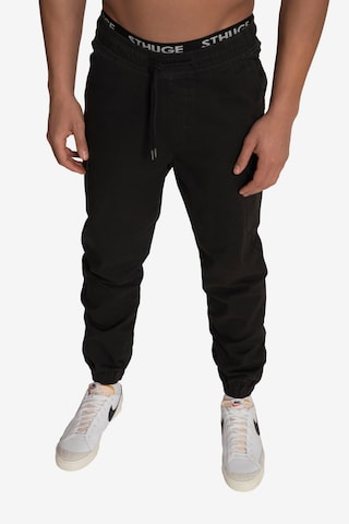 STHUGE Tapered Cargo Pants in Black: front