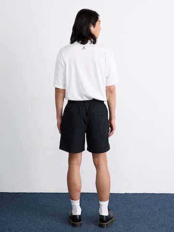 Nike Sportswear Loosefit Nadrág 'Tech' - fekete