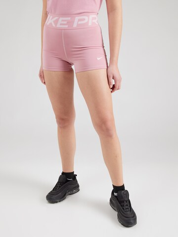 Skinny Pantaloni sportivi di NIKE in rosa: frontale