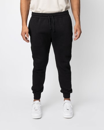 SNOCKS Tapered Pants in Black: front