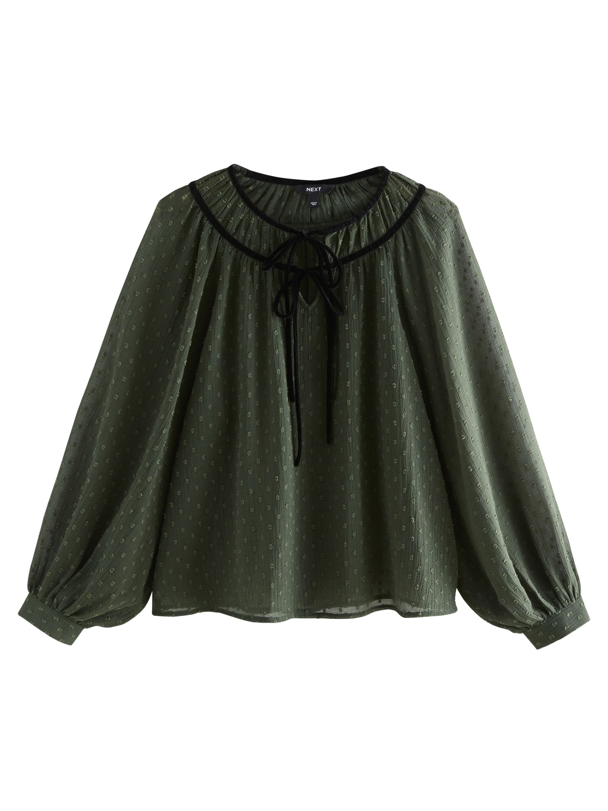 Next Blus i grön: framsida